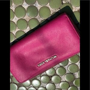 Used good condition fuchsia michael kors wallet.